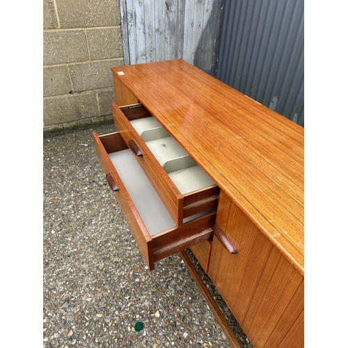 240 - A mid century teak sideboard by SCHRIBER 136x40x74