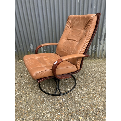 241 - A mid century style tan brown leather and rosewood effect swivel chair