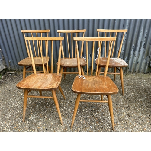 242 - A set of five ercol light elm stick back kitchen chairs