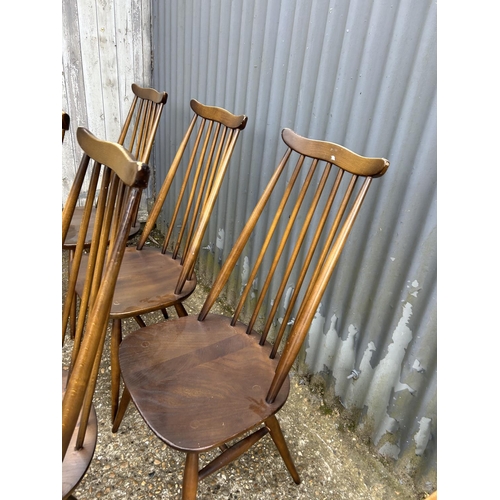 243 - A set of six dark ercol stick back chairs