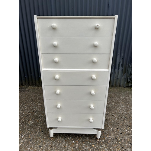 244 - A white painted tallboy chest of seven drawers 60x40x130