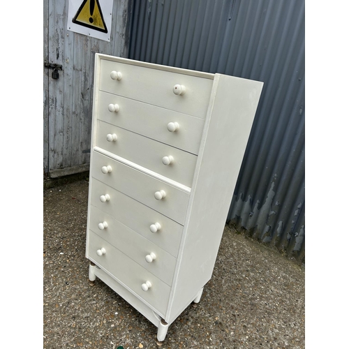 244 - A white painted tallboy chest of seven drawers 60x40x130