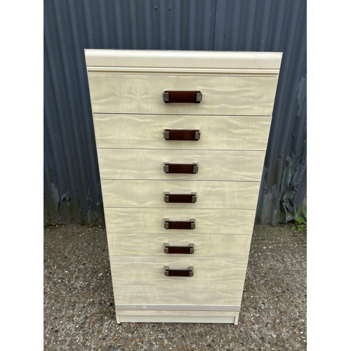 245 - A gloss white tallboy chest of seven