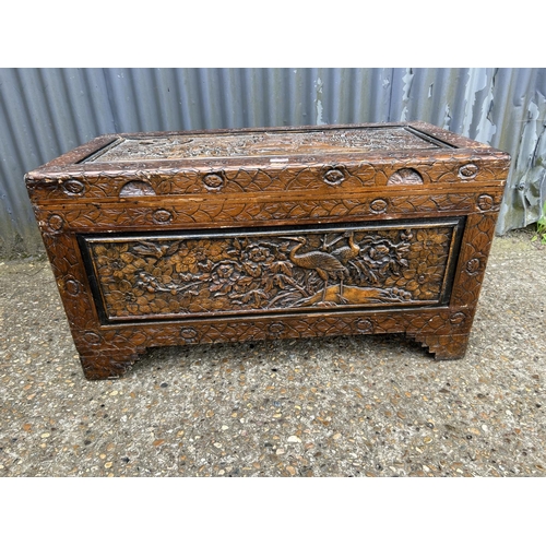 250 - An oriemtal carved camphor wood blanket box 100x50x55