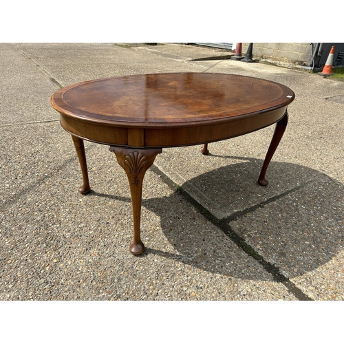 252 - A mahogany Oval Office writing table with brown leather top  168x108