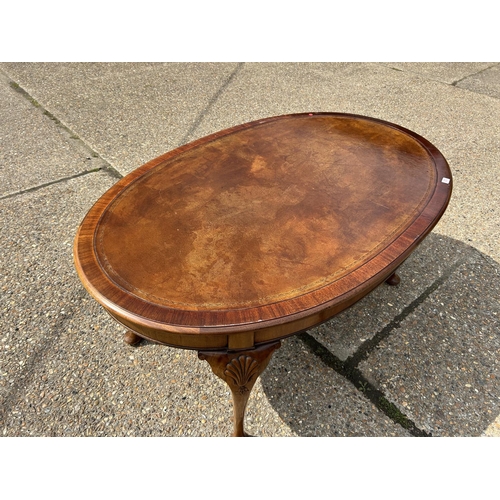 252 - A mahogany Oval Office writing table with brown leather top  168x108