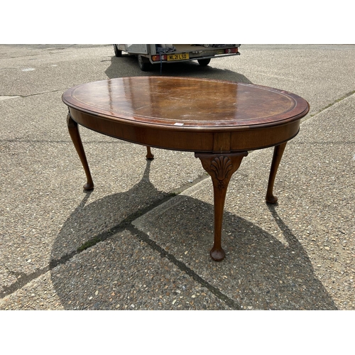 252 - A mahogany Oval Office writing table with brown leather top  168x108