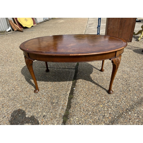 252 - A mahogany Oval Office writing table with brown leather top  168x108