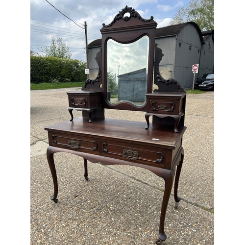 256 - An ornate mahogany two drawer dressing table