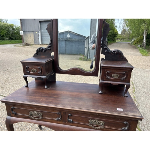 256 - An ornate mahogany two drawer dressing table