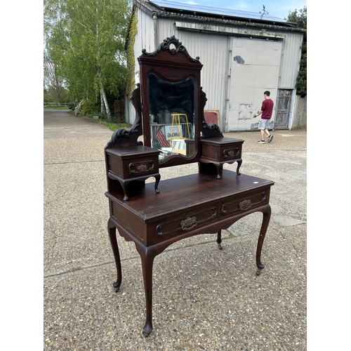 256 - An ornate mahogany two drawer dressing table