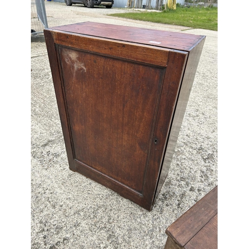 268 - A mahogany cupboard together with a commode