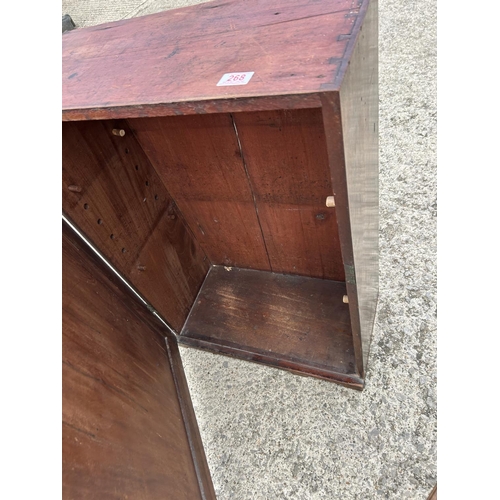 268 - A mahogany cupboard together with a commode