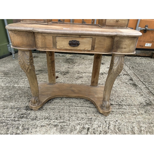 269 - A stripped pine dressing table with swing mirror