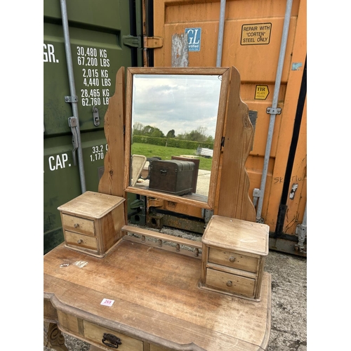 269 - A stripped pine dressing table with swing mirror