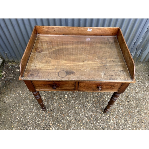 29 - A Mahogany two drawer writing table 84x58x88