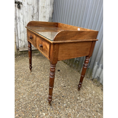 29 - A Mahogany two drawer writing table 84x58x88