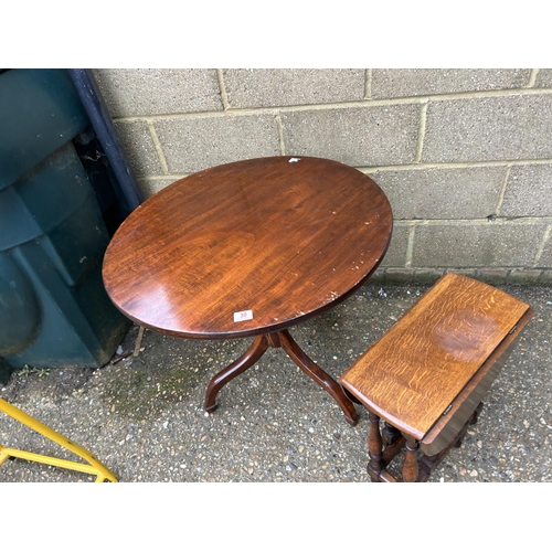 30 - A mahogany tripod table and a small oak drop leaf table