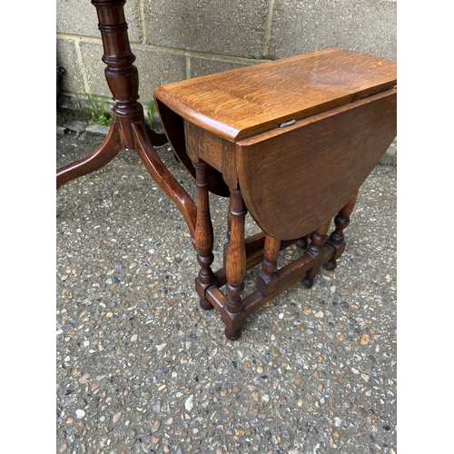 30 - A mahogany tripod table and a small oak drop leaf table