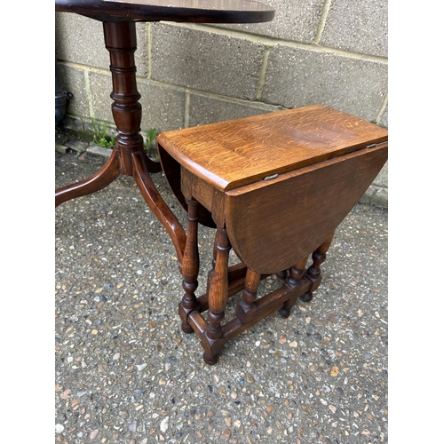 30 - A mahogany tripod table and a small oak drop leaf table