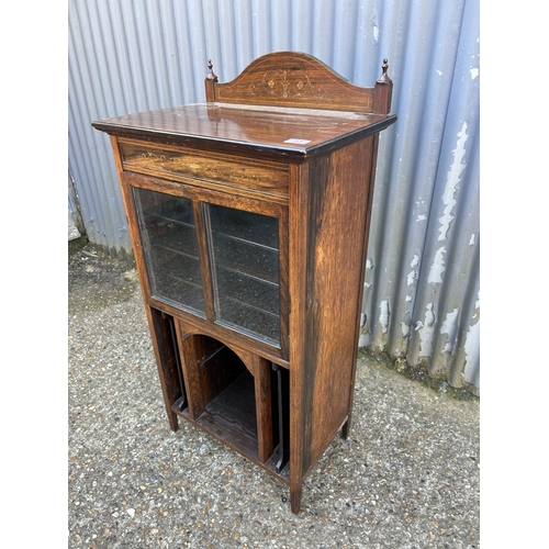 33 - A Victorian rosewood music cabinet