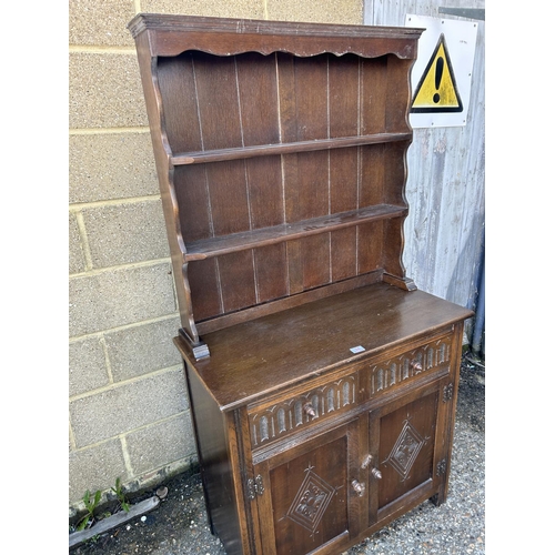 34 - A carved oak linenfold dresser 92x44 x177