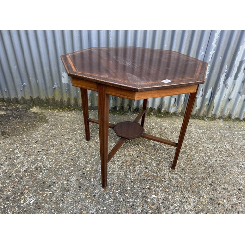 38 - An Edwardian octagonal occasional table 77cm diameter