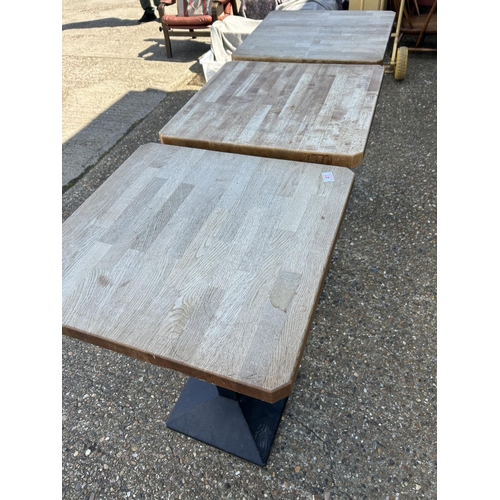 41 - Three iron based pub tables with thick beech wood tops 62x62x90