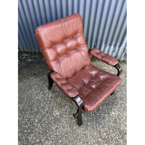 43 - A mid century dark red leather reclining easy chair