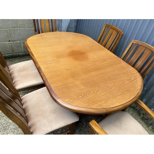 48 - A mid century teak extending dining table together with six chairs by JENTIQUE 140 x94