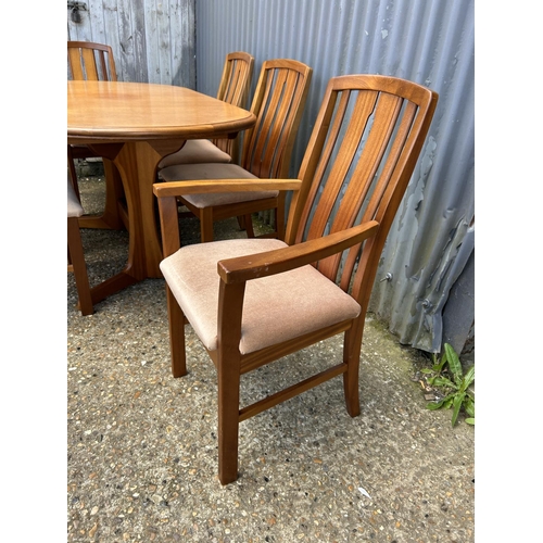 48 - A mid century teak extending dining table together with six chairs by JENTIQUE 140 x94