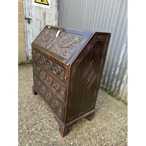 56 - A antique carved oak bureau 92x50x115