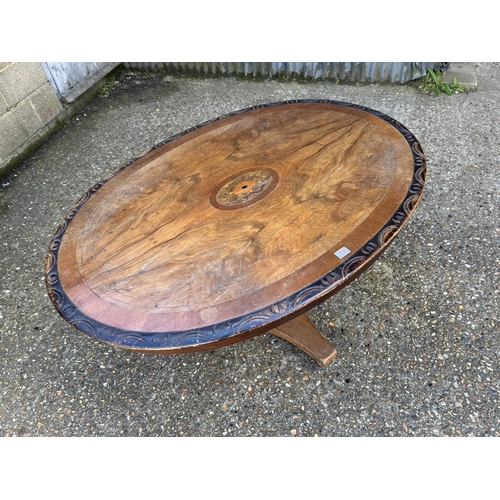 59 - A victorian walnut oval  tilt top breakfast table 140x100