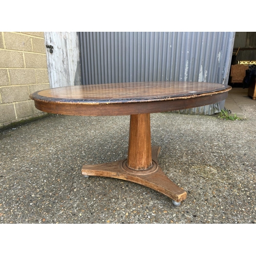 59 - A victorian walnut oval  tilt top breakfast table 140x100