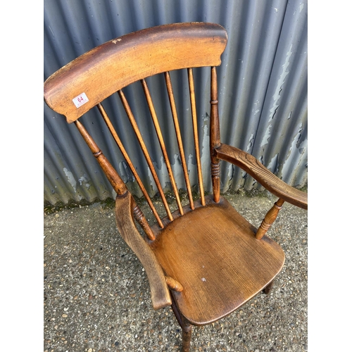 64 - A Windsor kitchen stick back carver chair