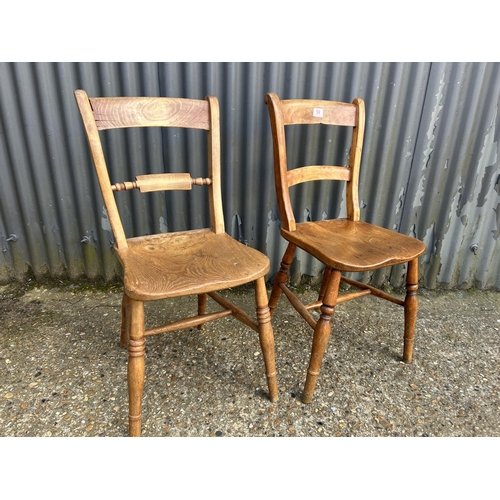 69 - A pair of vintage pine kitchen chairs