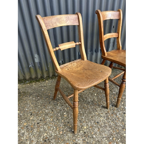 69 - A pair of vintage pine kitchen chairs