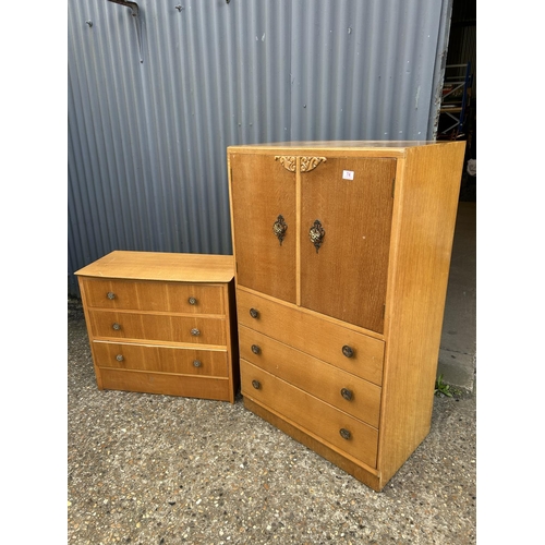 74 - A mid century light oak bedroom pair consisting of a tallboy and matching chest of four