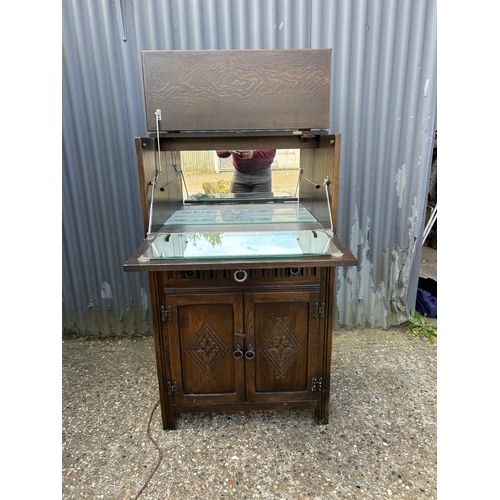 77 - A oak linenfold drinks cabinet 75x43 x133