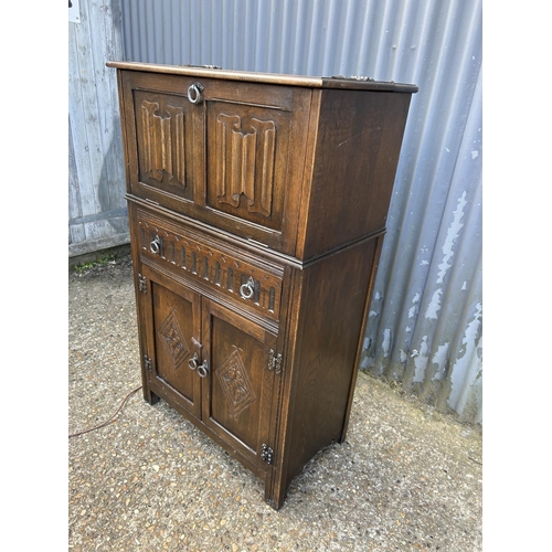 77 - A oak linenfold drinks cabinet 75x43 x133