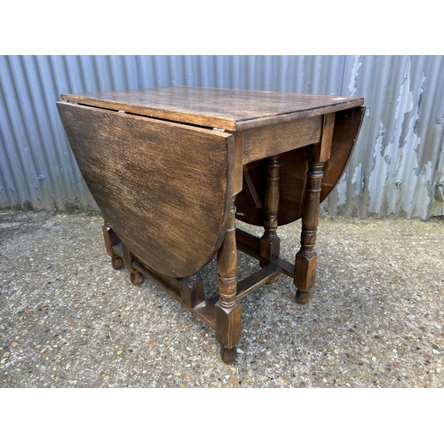 78 - A large oak gateleg table