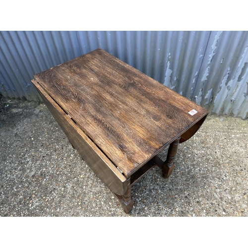 78 - A large oak gateleg table