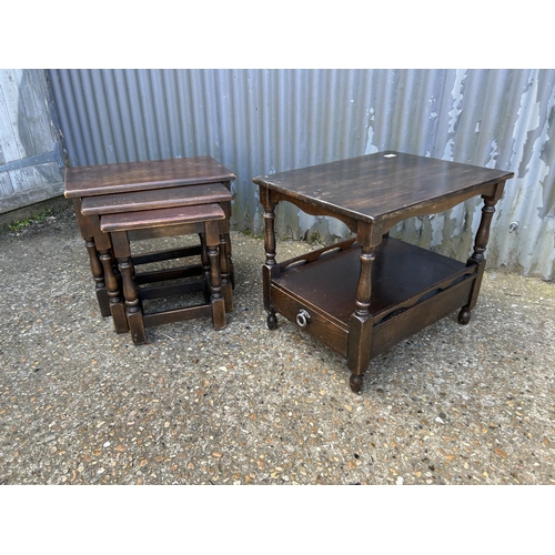 79 - An oak nest of three tables together with a single drawer side table