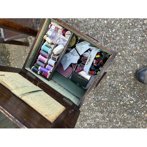 80 - An oak two drawer hall table together with a sewimg box