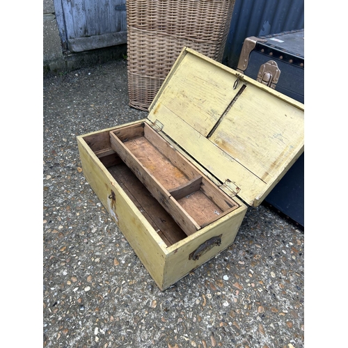 83 - A very large trunk, wooden tool box and a wicker basket containing wool