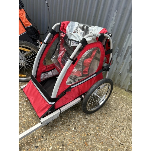 89 - A trailer bike and all terrain push chair