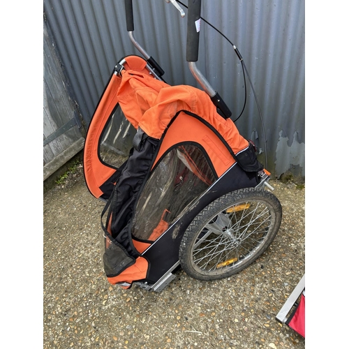 89 - A trailer bike and all terrain push chair