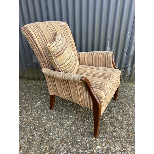 94 - A teak framed armchair with stripe upholstery