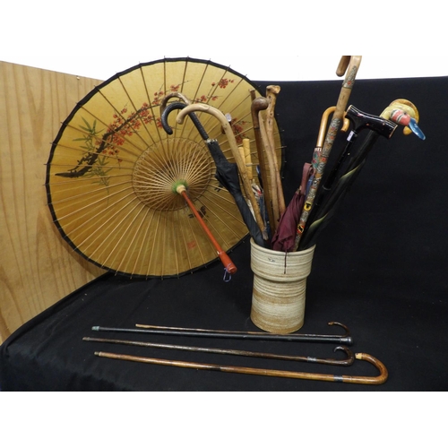 507 - Pottery walking sticks stand, walking Sticks, (4 Silver Mounted) parasol and umbrellas