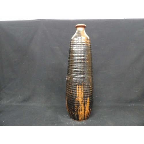 516 - Tall studio pottery vase, height 74cms